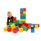 Little girl with giant Lego blocks.