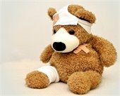 Bandaged stuffed bear