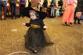 Young girl in a witch costume.