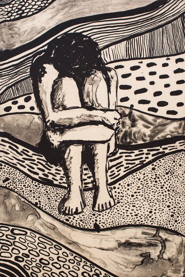 Image of person sitting down with head down and arms wrapped around knees.