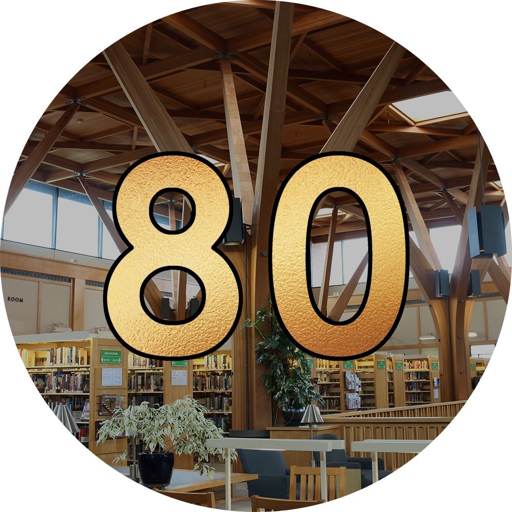 Circular photo of the inside of a library building with a gold number 80 on top.